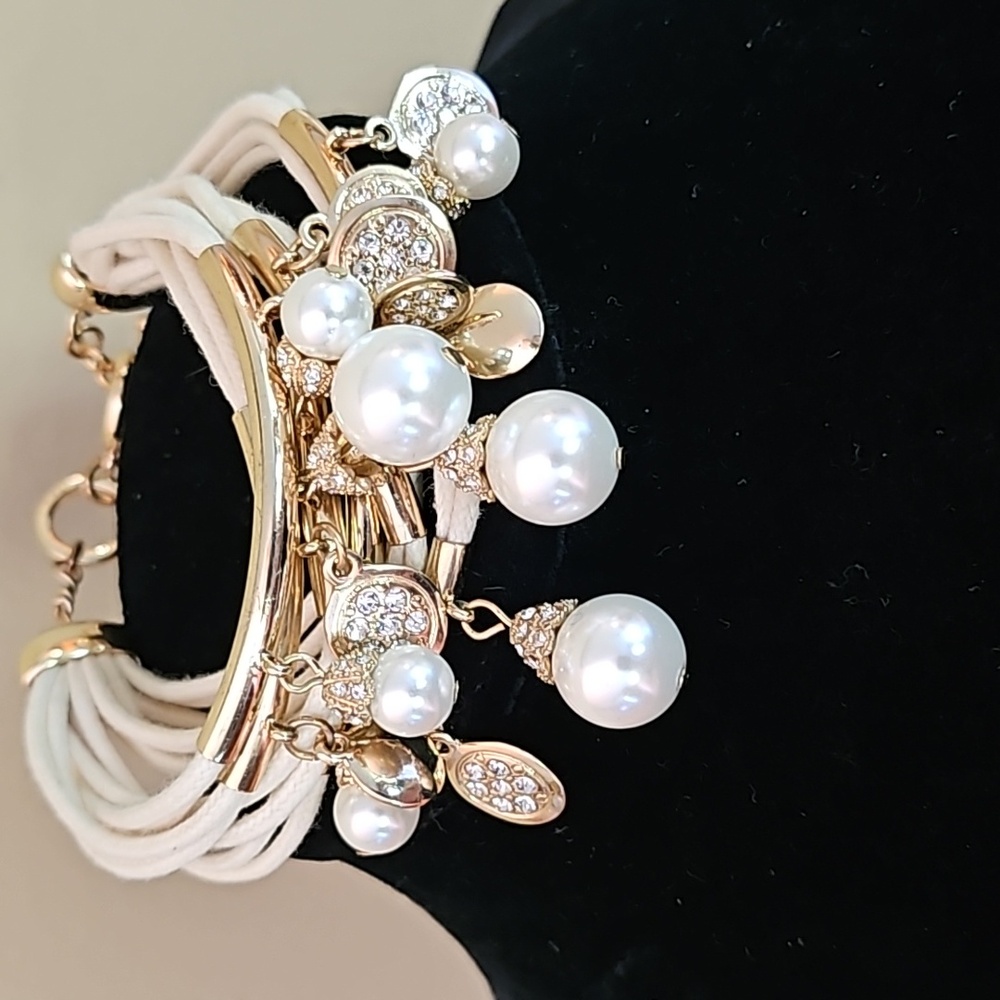 Faux pearl goldtone and rhinestone bracelet.